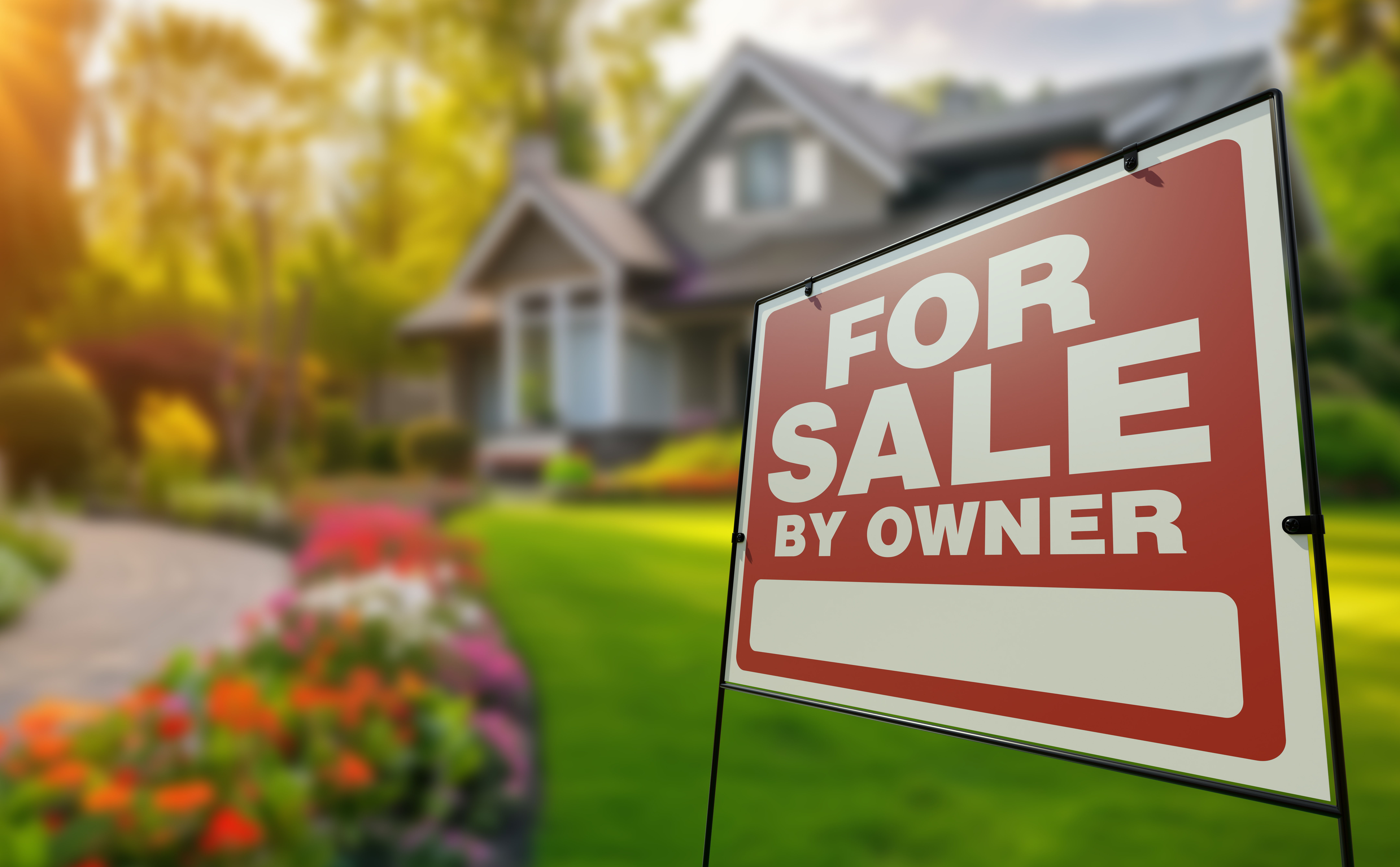 For Sale By Owner Real Estate Yard Sign In Front Of A Beautiful House.